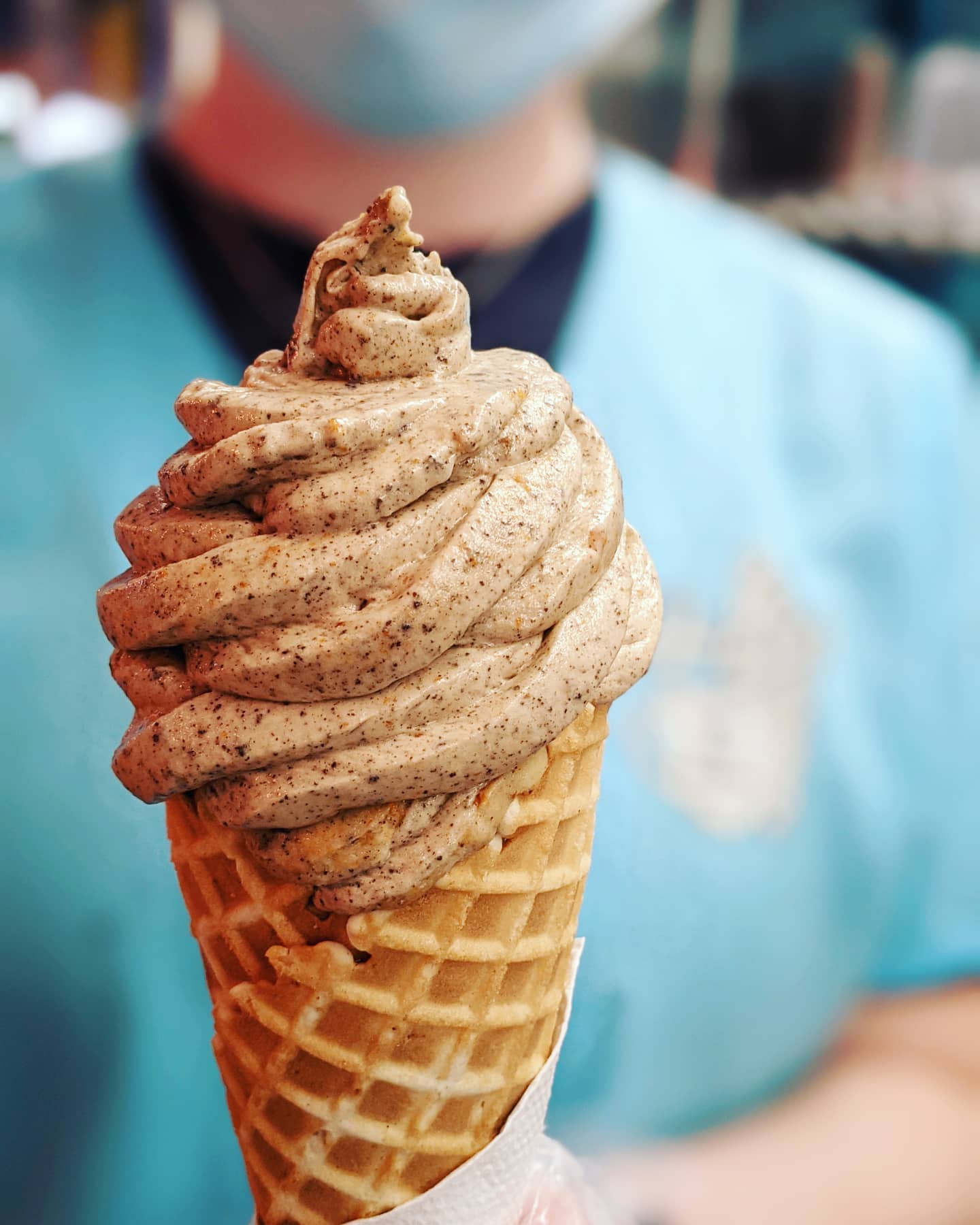 Non-dairy Banana Cream with Oreo and peanut butter served in a waffle cone