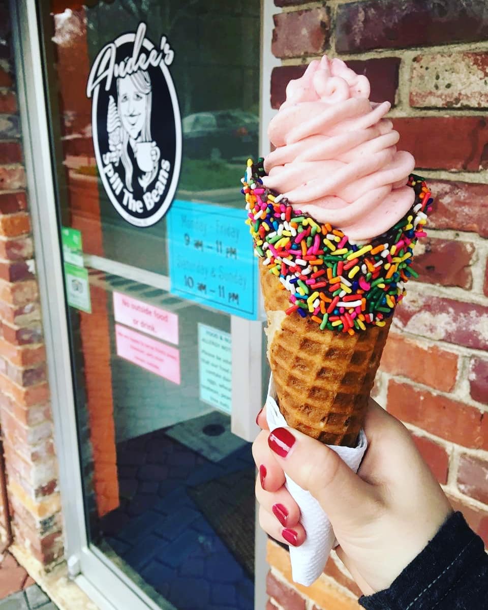 Chocolate dipped waffle cone with sprinkles and ice cream